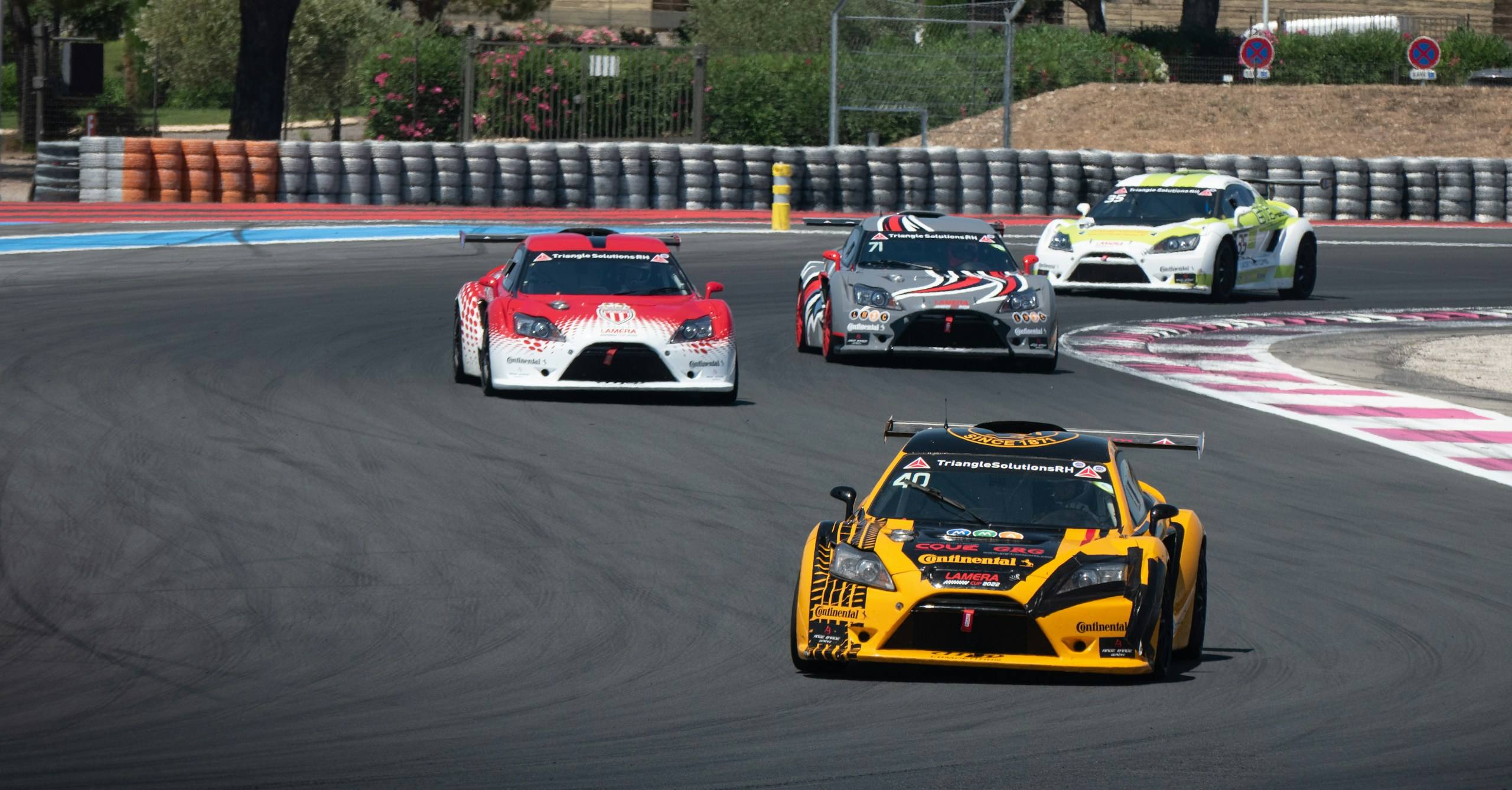 Track day cars through a corner